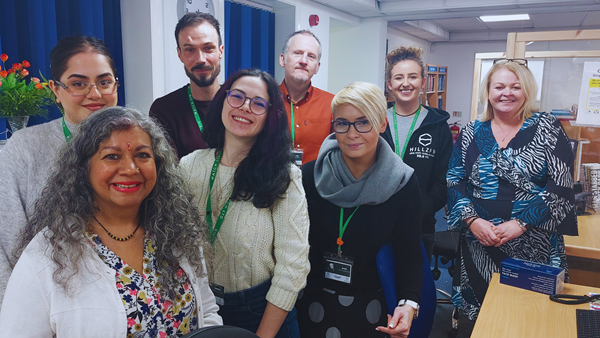 Volunteers at a charity in Coventry, that supports asylum seekers and refugees, smile at the camera