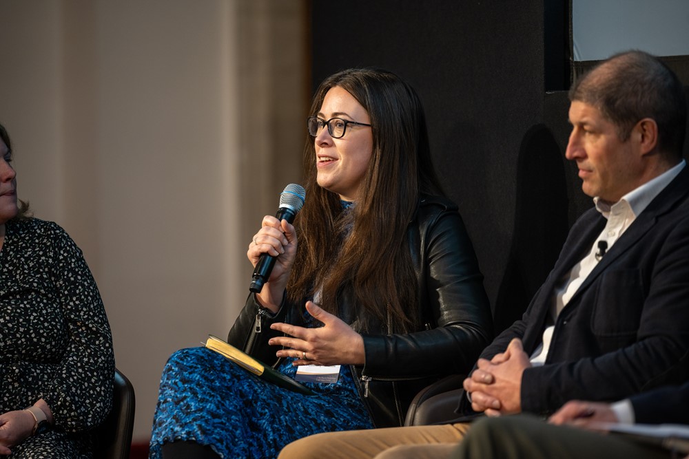 Emma de Closset, CEO at UKCF, speaking with a microphone on stage